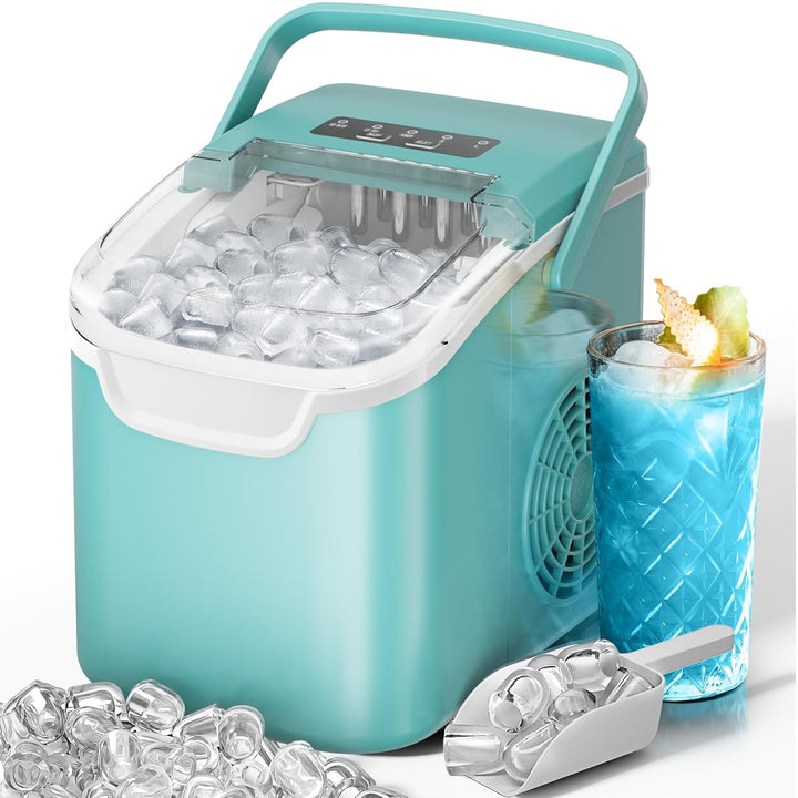 Turquoise ice maker with a glass of blue drink and ice cubes on a white background