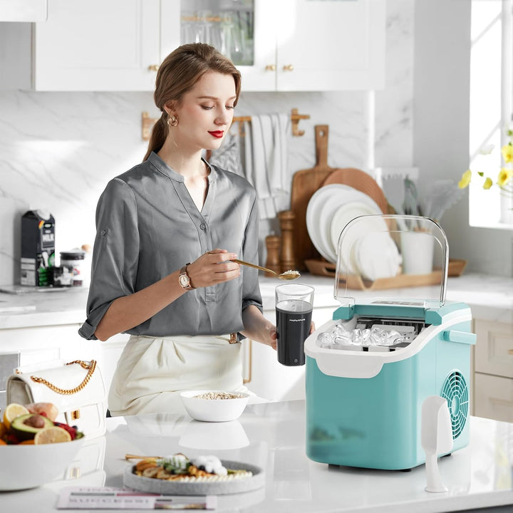 Woman in a kitchen with a teal ice maker on the counter