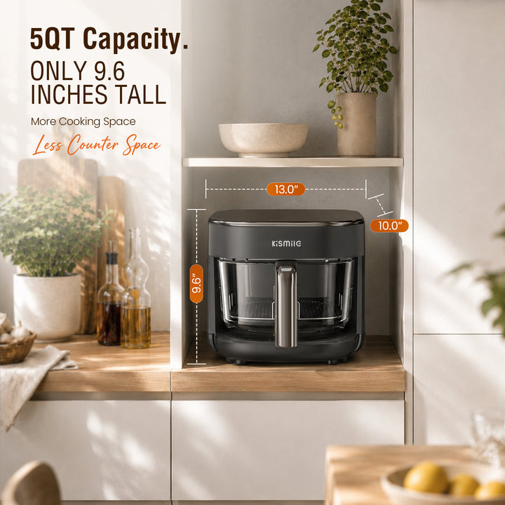 A countertop air fryer in dark gray is shown in a styled kitchen setting with overlaid dimension callouts and text stating 5QT Capacity and only 9.7 inches tall.