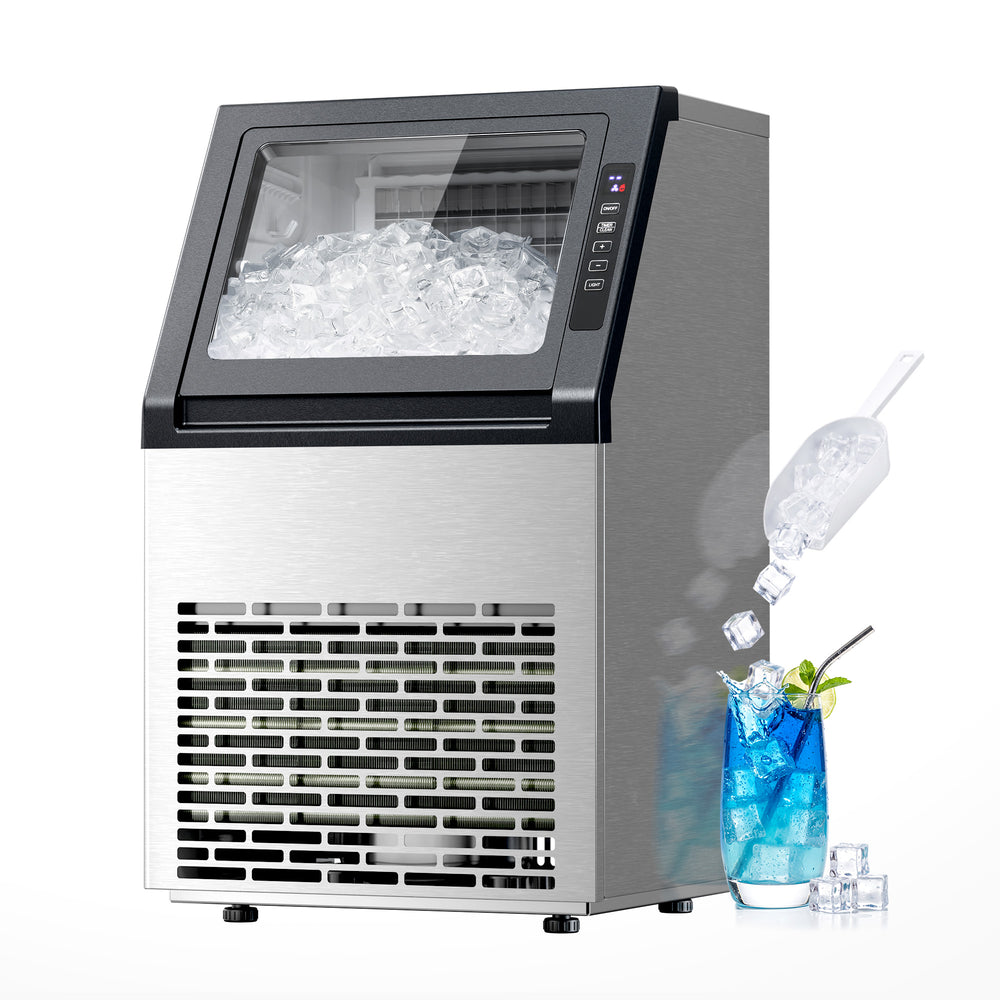 A stainless steel and black ice machine filled with ice, shown on a white background with a glass of blue drink and ice cubes as a usage demonstration.