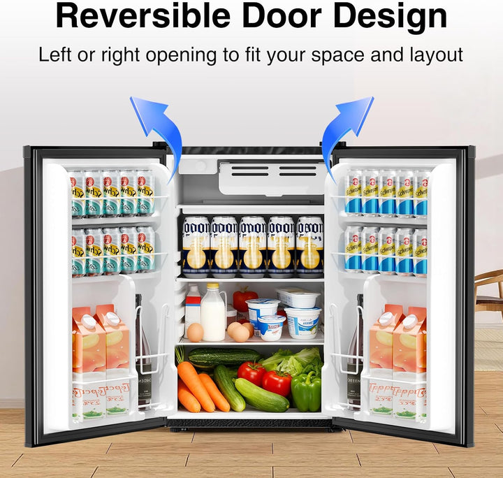 A black-framed refrigerator shown open to demonstrate a reversible door design, with text at the top reading 'Reversible Door Design' and blue arrows indicating left or right opening. The interior is stocked with drinks, milk cartons, eggs, vegetables, and other groceries.