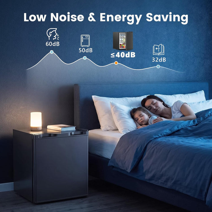A low-noise night light shown in a bedroom scene with a woman and child sleeping in bed. The product is a small rectangular light on a dark bedside table, with overlaid text and icons reading 'Low Noise & Energy Saving' and decibel levels 60dB, 50dB, ≤40dB, and 32dB.