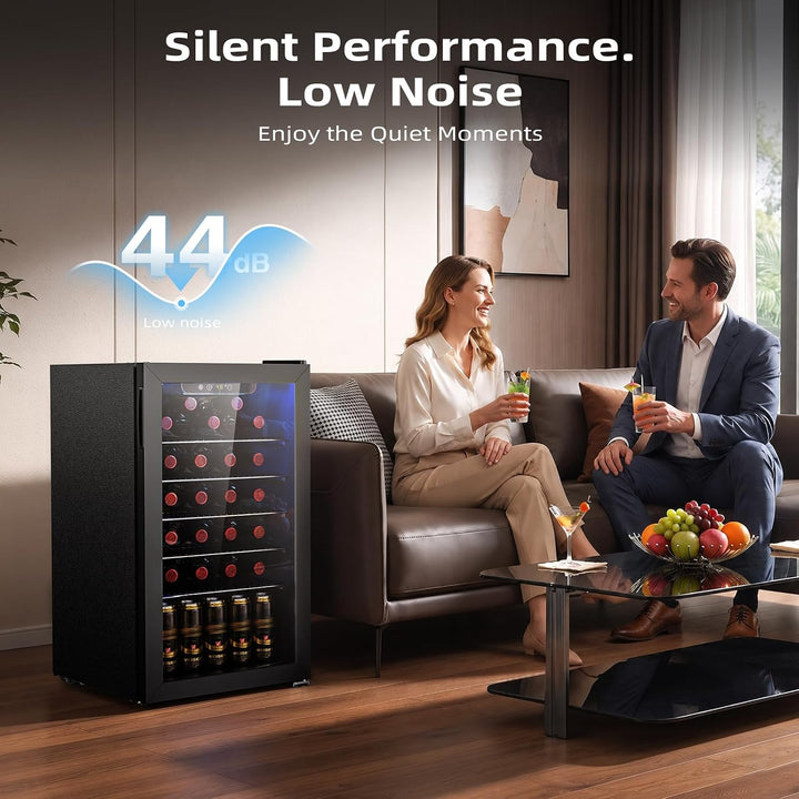 A black under-counter wine refrigerator with a glass door stands in a modern living room next to a sofa, with a man and woman sitting on the couch. Text overlays read 'Silent Performance.