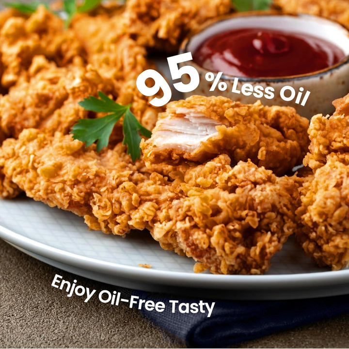 Fried chicken on a plate with ketchup and text indicating '95% Less Oil' and 'Enjoy Oil-Free Tasty'.
