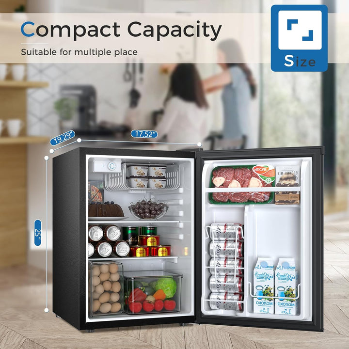Compact refrigerator with food items inside, showing capacity and dimensions, with a blurred background of people and furniture.