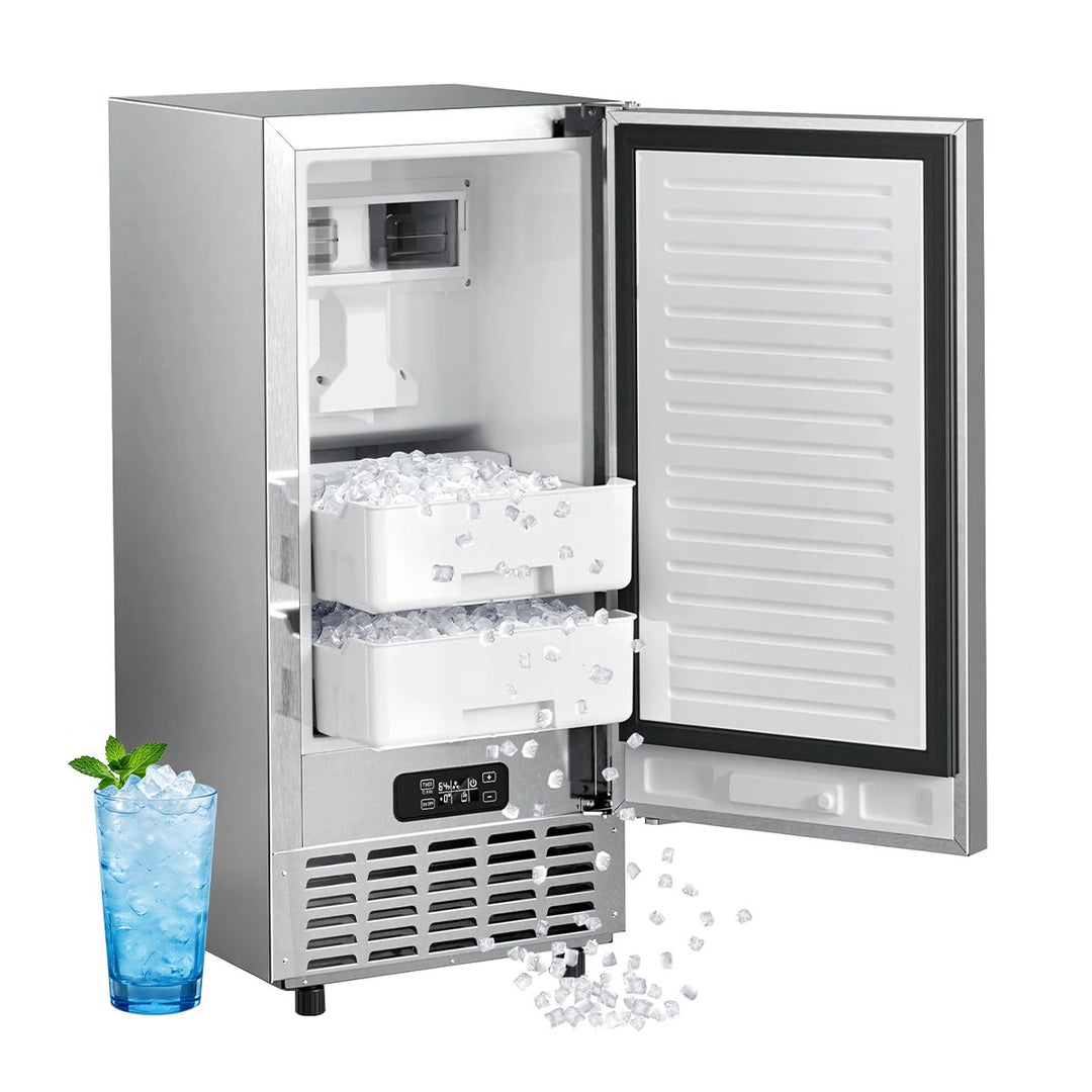 A stainless steel undercounter refrigerator with its door open, showing two white ice bins filled with ice. A blue glass of iced drink with mint is placed beside it on a white background.