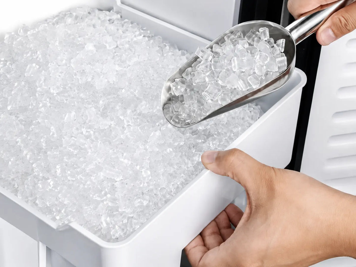 Kismile Z5830N nugget ice maker storage bin filled with chewable nugget ice and stainless steel ice scoop